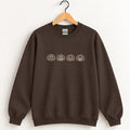 Jack-o-lantern embroidered crewneck sweatshirt in Dark Chocolate on a wooden hanger