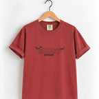Spooky Season embroidered tee in Chili on a wooden hanger