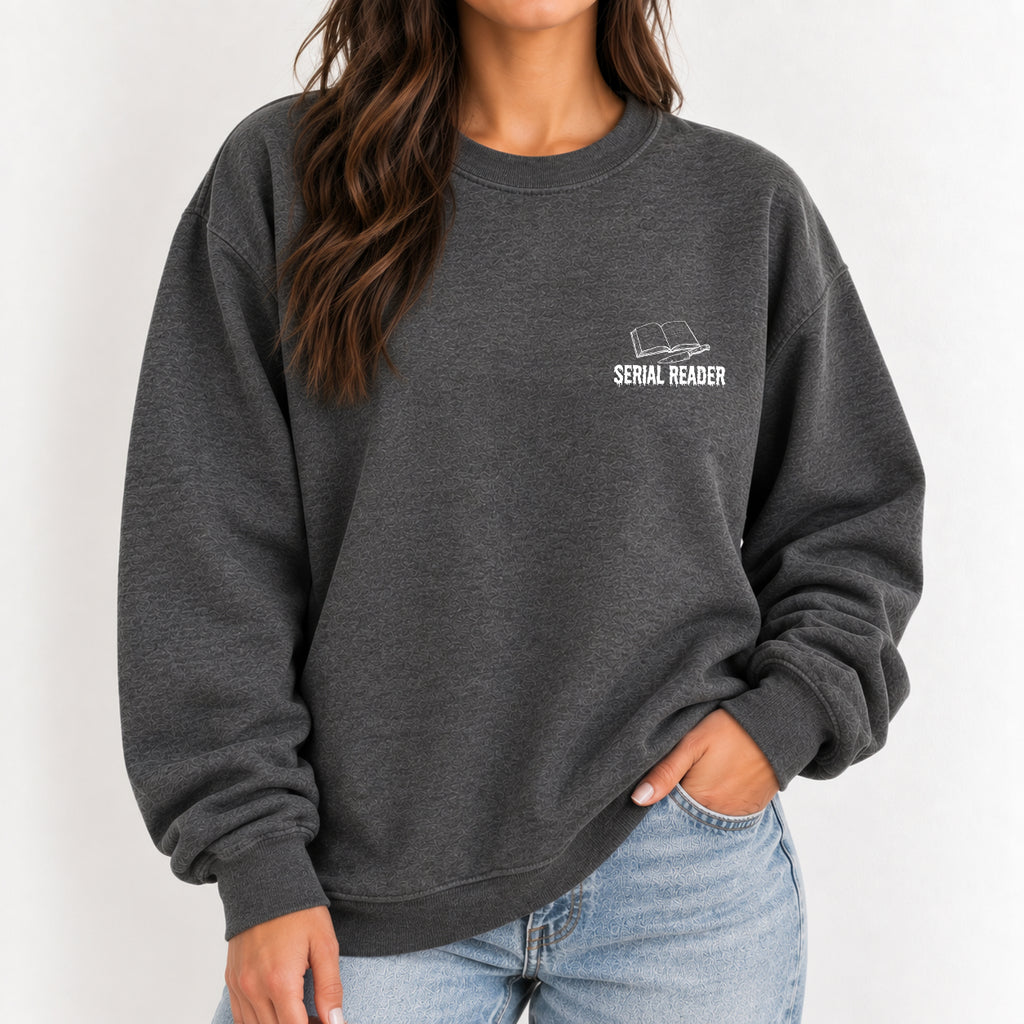 Woman wearing the Serial Reader crewneck sweatshirt in Dark Heather with jeans