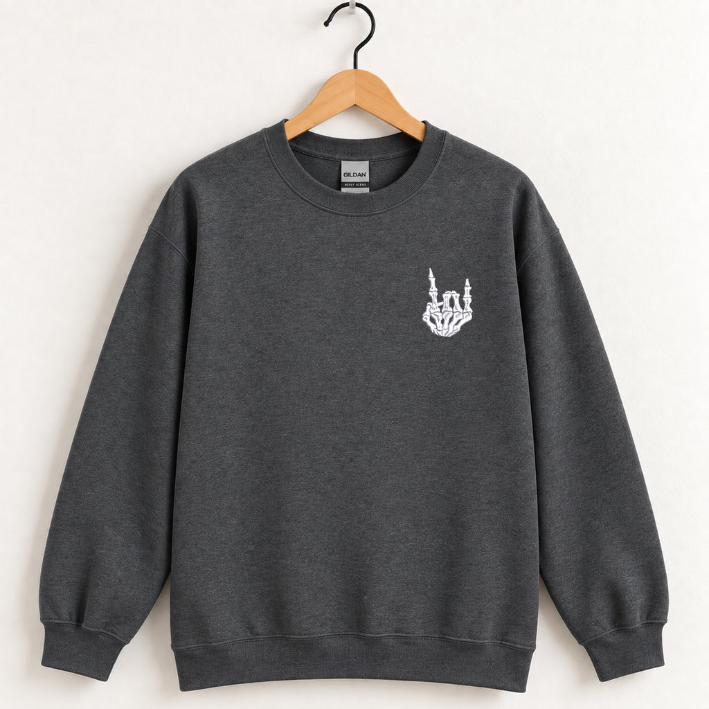 Rock On Skeleton Hand embroidered crewneck sweatshirt in Dark Heather on a wooden hanger