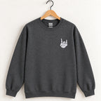 Rock On Skeleton Hand embroidered crewneck sweatshirt in Dark Heather on a wooden hanger