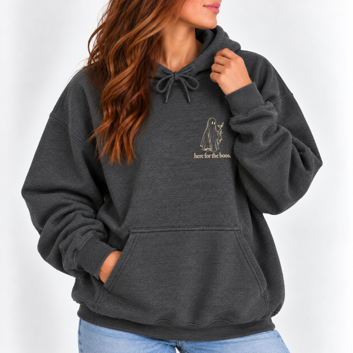 Woman wearing the Here for the Boos hoodie in Dark Heather with jeans