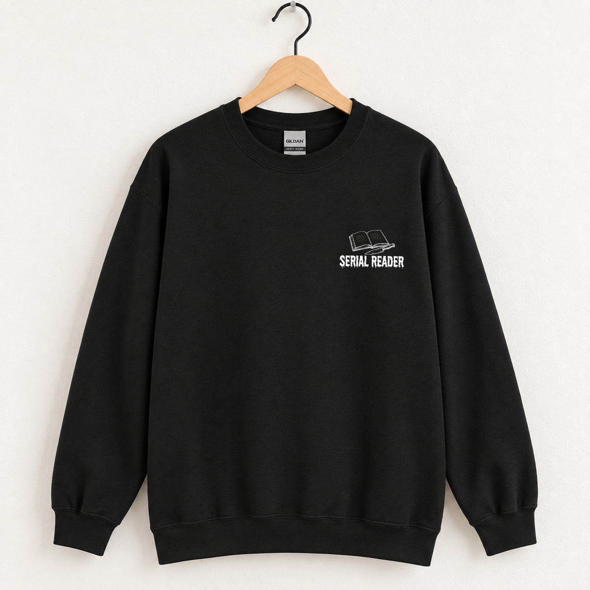 Serial Reader crewneck sweatshirt in Black on a wooden hanger