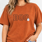 Woman wearing the Boo embroidered tee in Yam with jeans