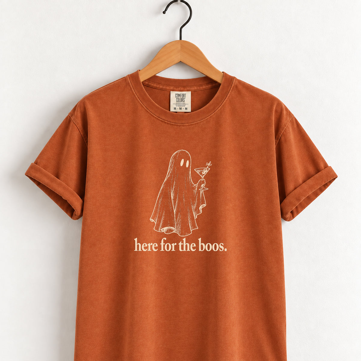 Here for the Boos tee in Yam (burnt orange) on a wooden hanger
