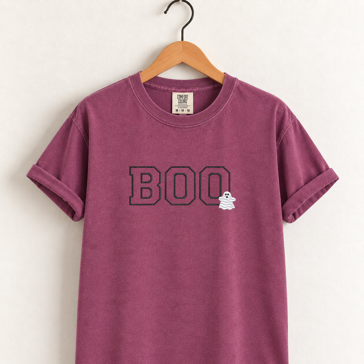 Boo embroidered tee in Berry on a wooden hanger