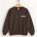 Serial Reader crewneck sweatshirt in Dark Chocolate on a wooden hanger