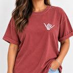 Woman wearing the shaka skeleton hand embroidered tee in Chili