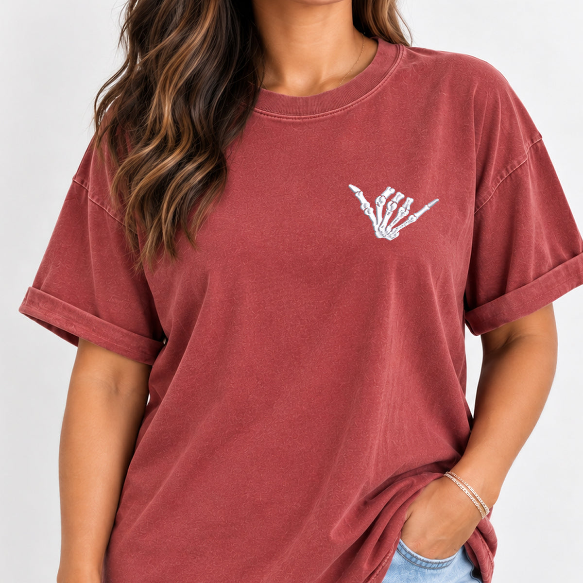 Woman wearing the shaka skeleton hand embroidered tee in Chili