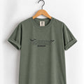 Spooky Season embroidered tee in Moss on a wooden hanger