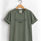 Spooky Season embroidered tee in Moss on a wooden hanger