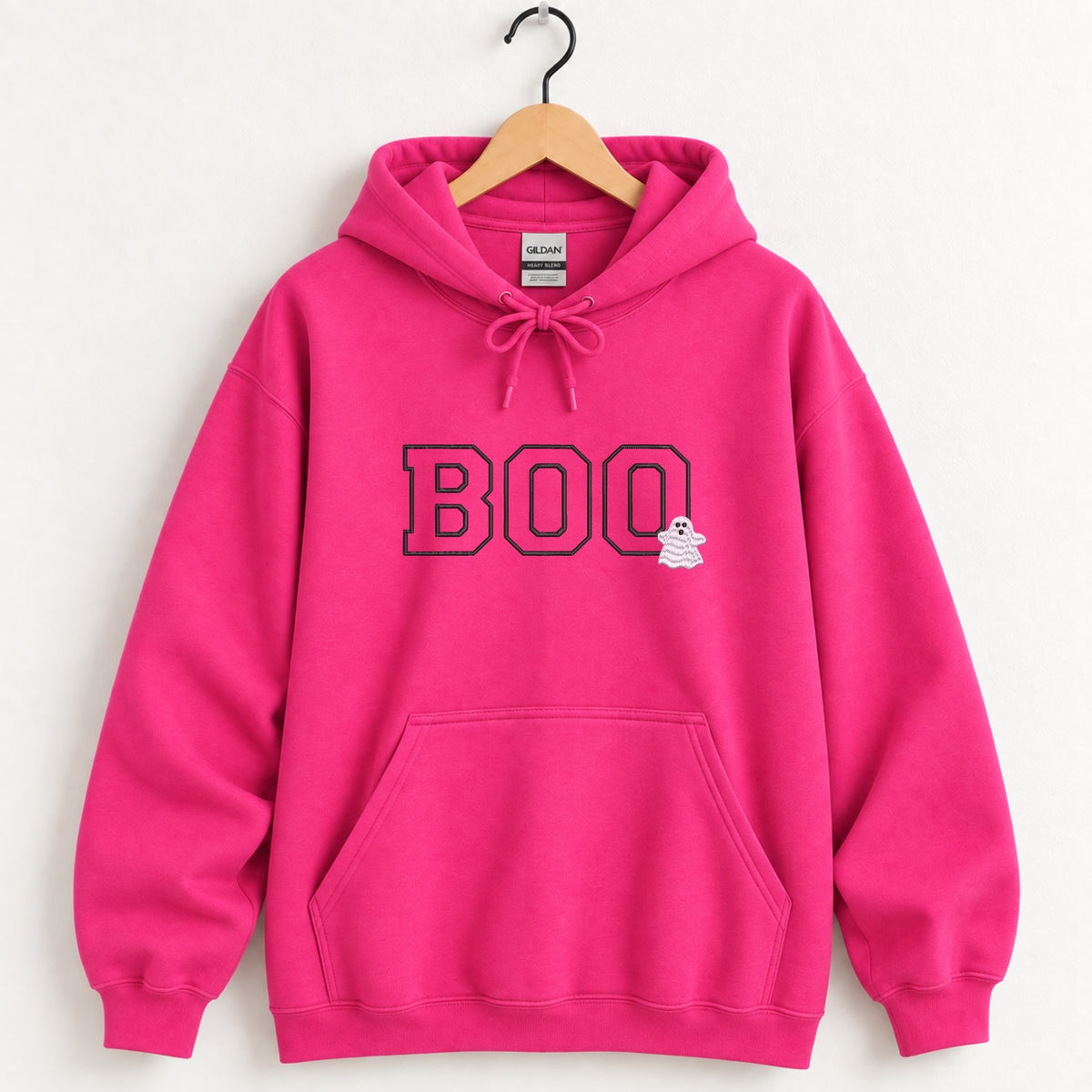 Boo embroidered hoodie in Heliconia pink on a wooden hanger