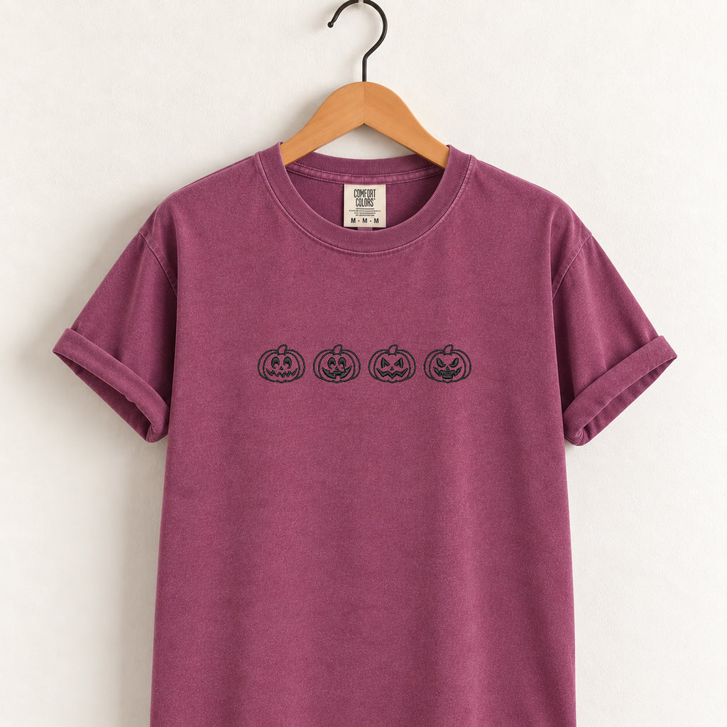 Jack-o-lantern embroidered tee in Berry on a wooden hanger