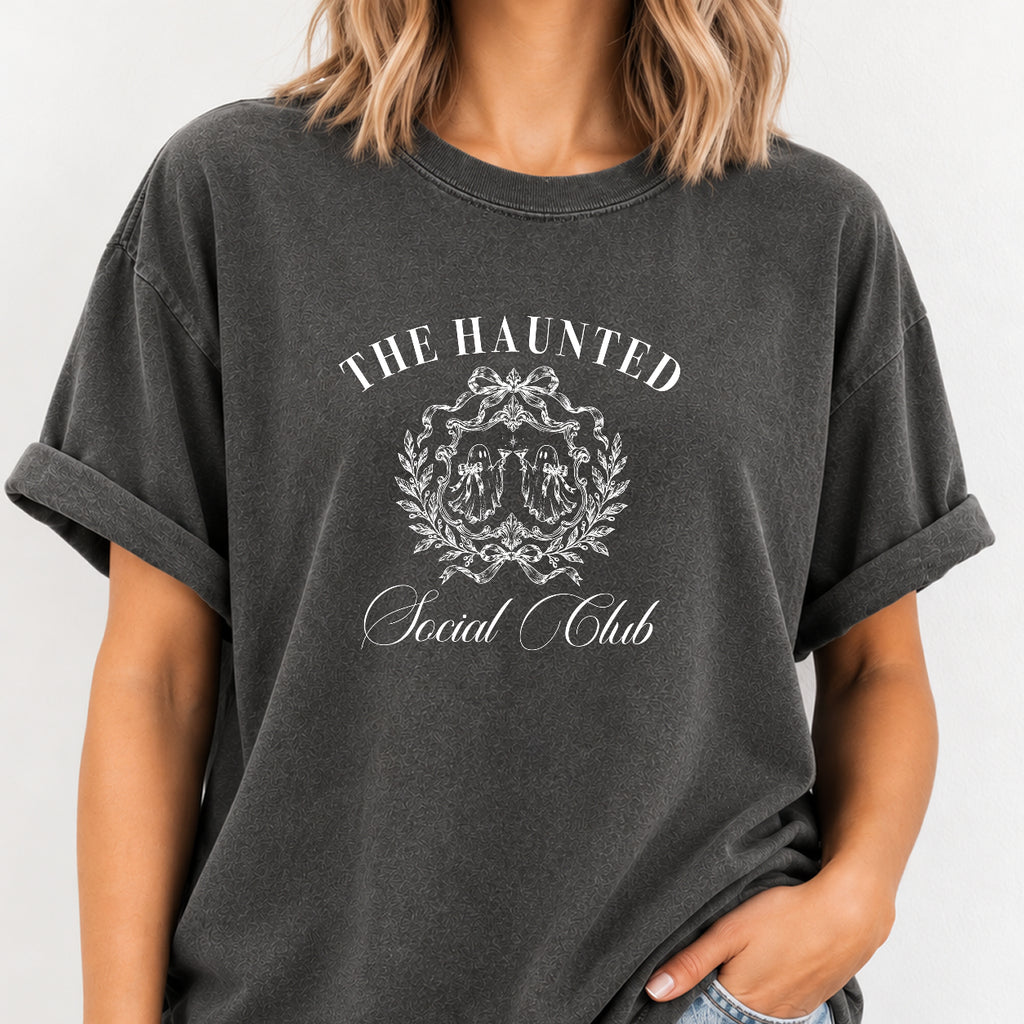 Woman wearing The Haunted Social Club crest tee in Pepper