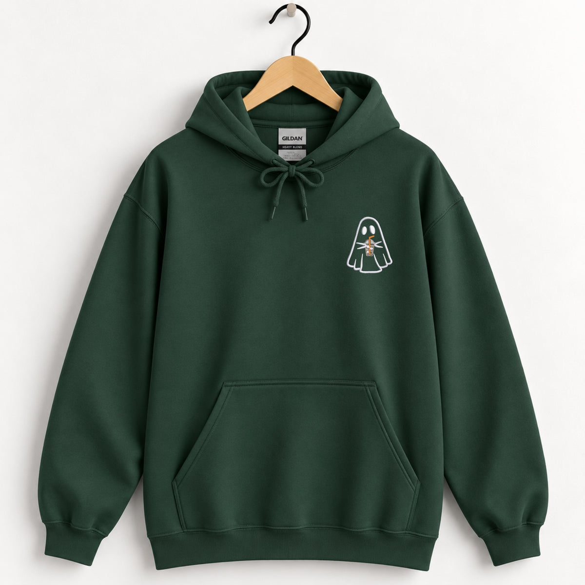 Ghost with a drink embroidered hoodie in Forest Green on a wooden hanger
