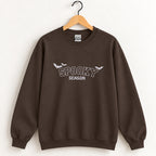 Spooky Season embroidered crewneck sweatshirt in Dark Chocolate on a wooden hanger