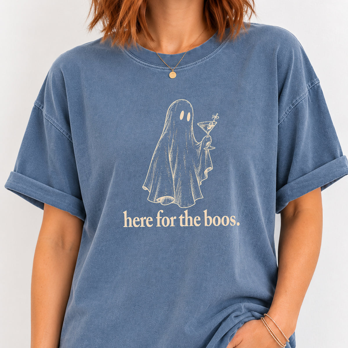 Woman wearing the Here for the Boos ghost martini tee in Blue Jean