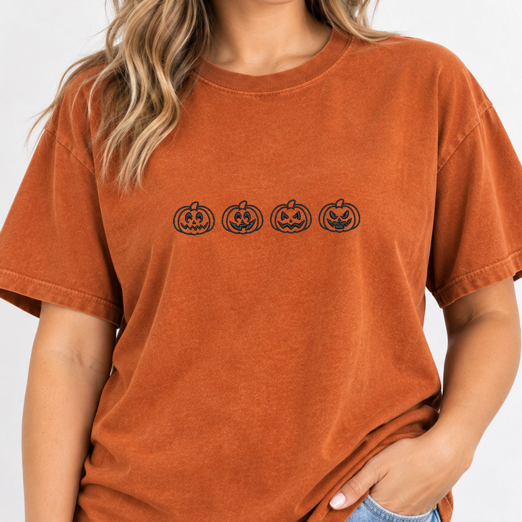 Woman wearing the jack-o-lantern embroidered tee in Yam