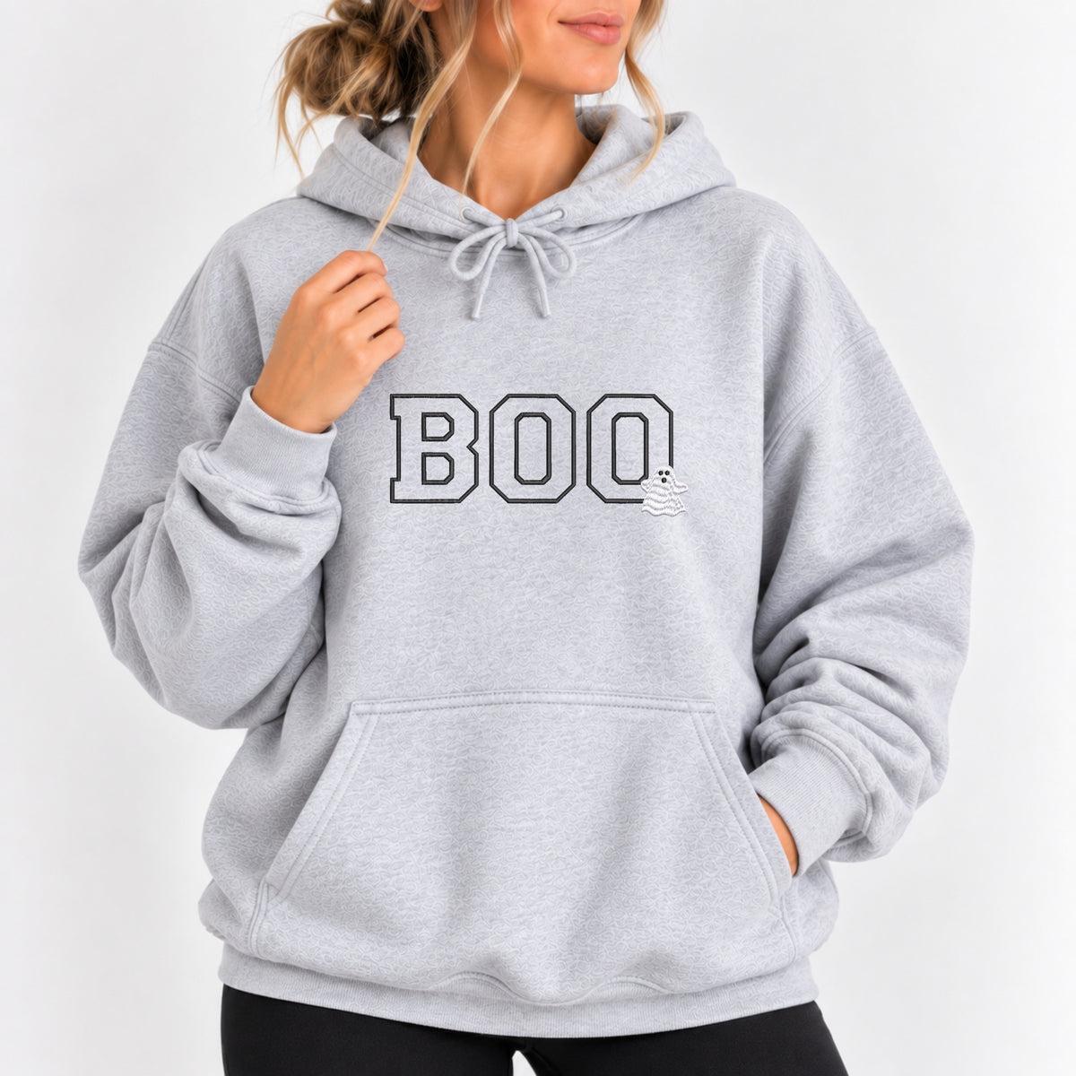 Woman wearing the Boo embroidered hoodie in Ash