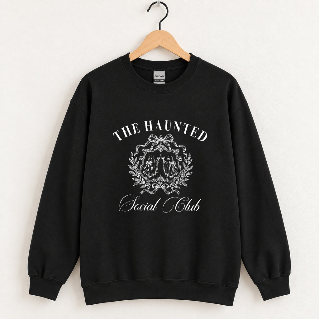 The Haunted Social Club crewneck sweatshirt in Black on a wooden hanger, off-white ghost crest on the chest