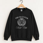 The Haunted Social Club crewneck sweatshirt in Black on a wooden hanger, off-white ghost crest on the chest