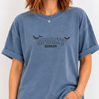 Woman wearing the Spooky Season embroidered bats tee in Blue Jean