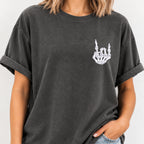 Woman wearing the rock on skeleton hand embroidered tee in Pepper