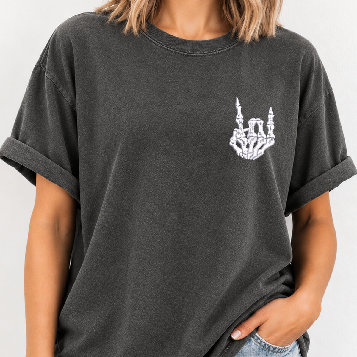 Woman wearing the rock on skeleton hand embroidered tee in Pepper