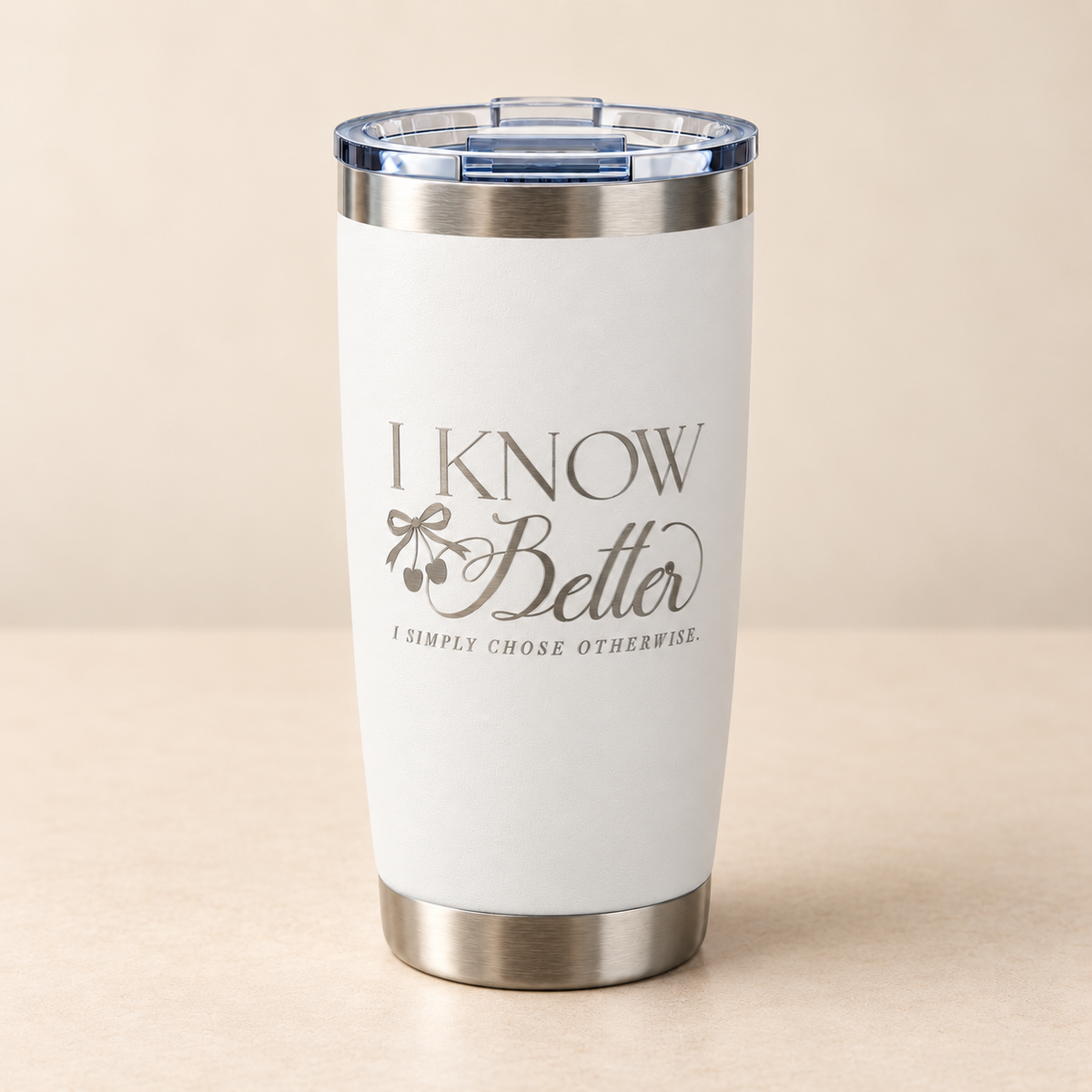 I Know Better engraved stainless steel tumbler in White on a cream surface, front view with slide-top lid