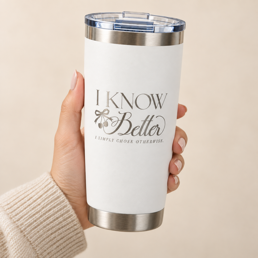 Hand holding the I Know Better, I Simply Chose Otherwise engraved 20 oz tumbler in White, silver engraving and cherry bow