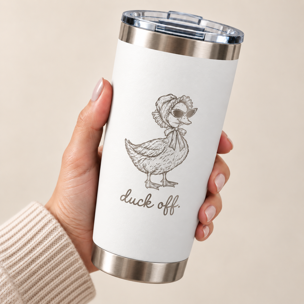 Hand holding the Duck Off engraved 20 oz tumbler in White, silver engraved duck in a bonnet