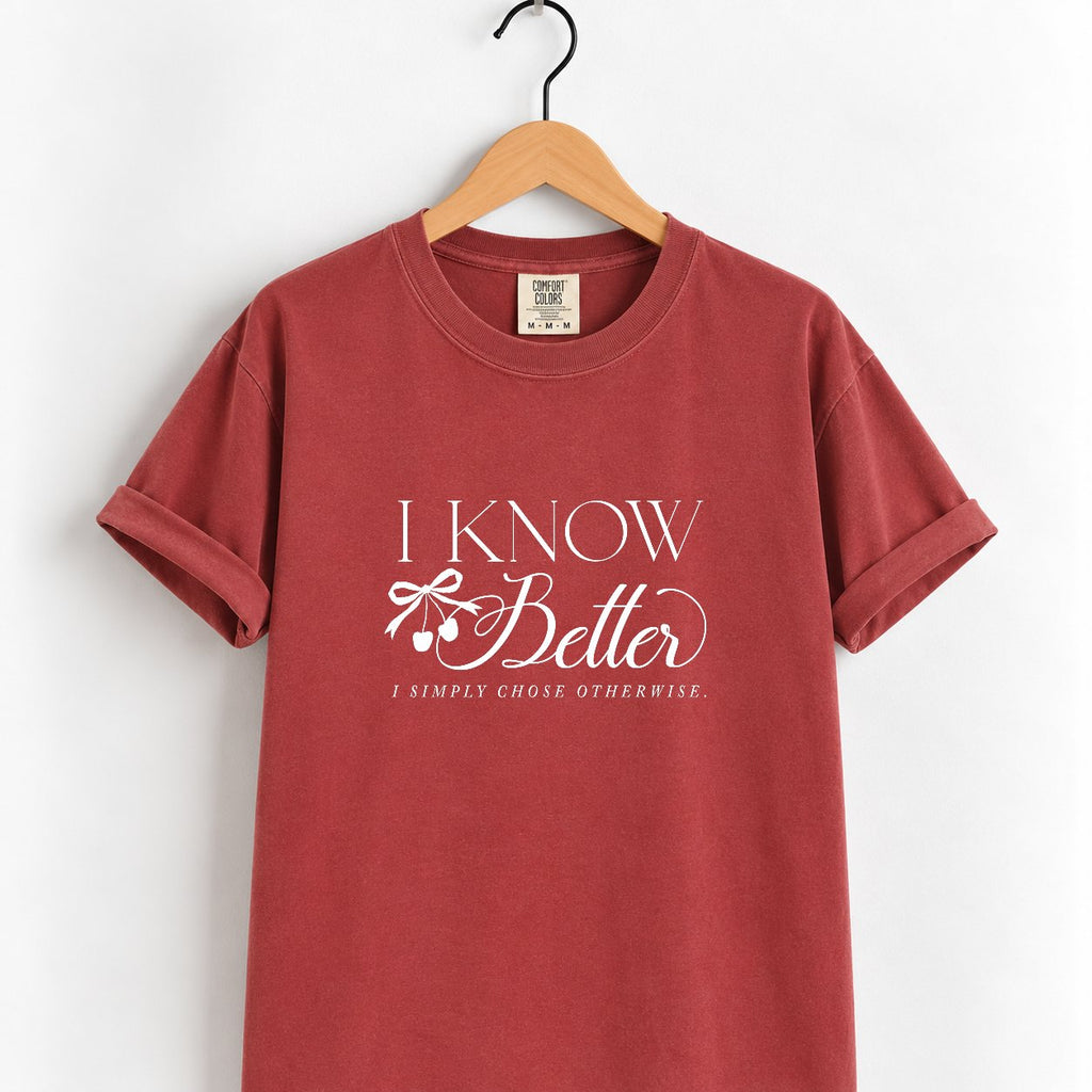 I Know Better, I Simply Chose Otherwise Comfort Colors tee in Chili on a wooden hanger, front view