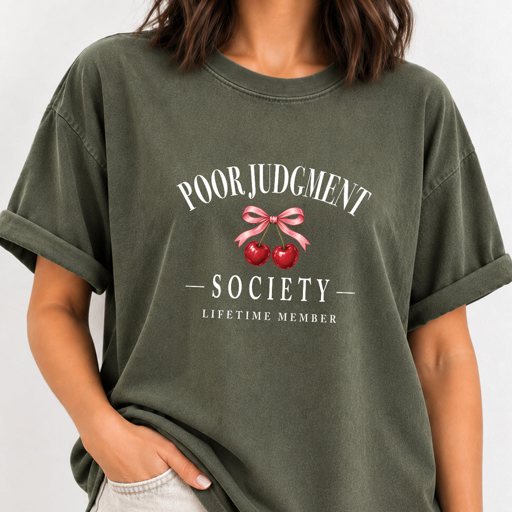 Woman wearing the Poor Judgment Society Lifetime Member tee in Moss