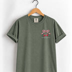 Mostly Together cherry bow tee in Moss on a wooden hanger