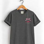 Mostly Together cherry bow tee in Pepper on a wooden hanger