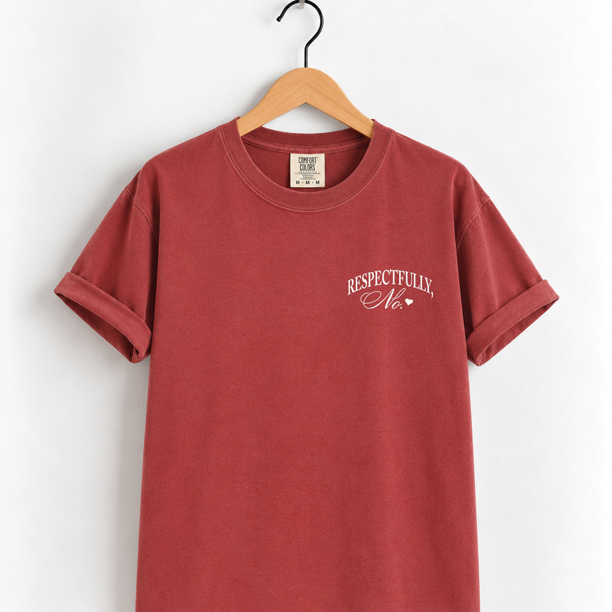 Respectfully, No tee in Chili on a wooden hanger