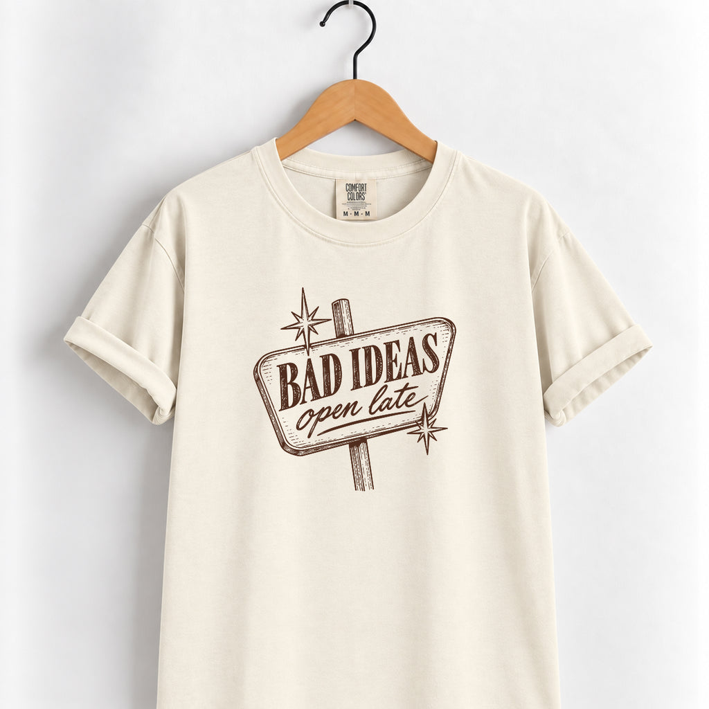 Bad Ideas, Open Late retro sign tee in Ivory on a wooden hanger, printed in vintage brown