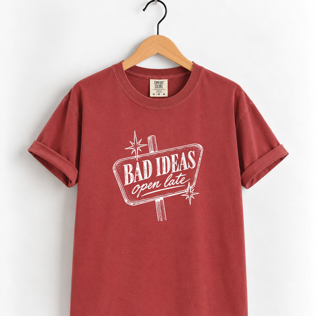 Bad Ideas, Open Late retro sign tee in Chili on a wooden hanger